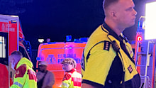 Emergency personnel tend to a person on a stretcher after a van drove into a crowd of people at a pride march in Berlin.