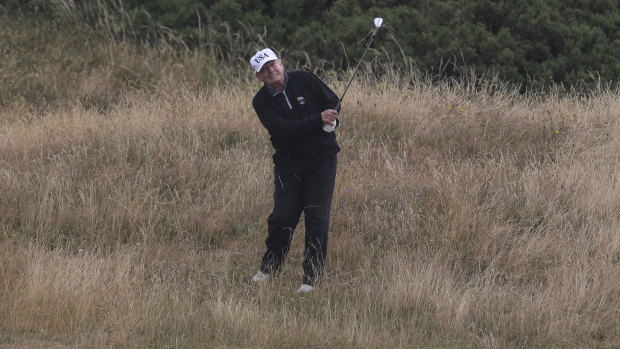 Individual pursuit: Donald Trump plays golf at Turnberry golf club in Scotland. 