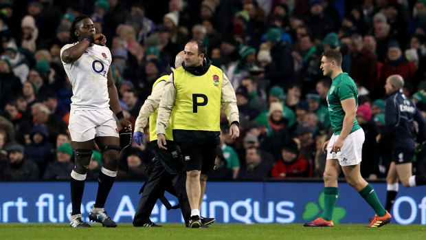 Blow: Maro Itoje, left, leaves the field with an injury that will see the England star miss Six Nations clashes against France and Wales.