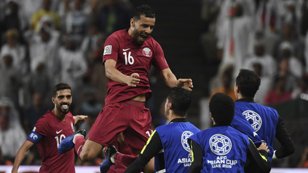 Final countdown: Boualem Khoukhi celebrates scoring the opener in Qatar's 4-0 Asian Cup semi-final rout of UAE.