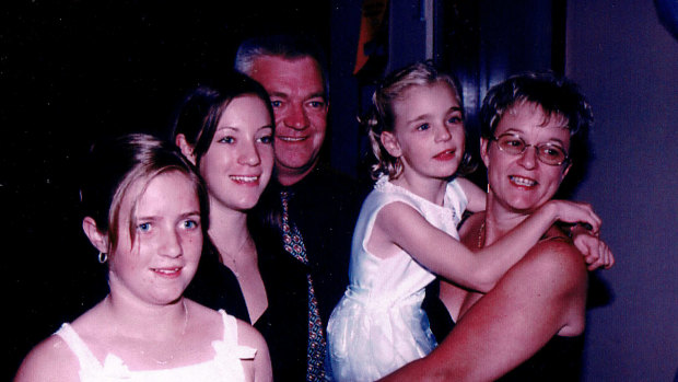 From left to right: Carlie, Chloe, Maurice, Lisa and Rhonda Higgins at a family wedding in 2003.