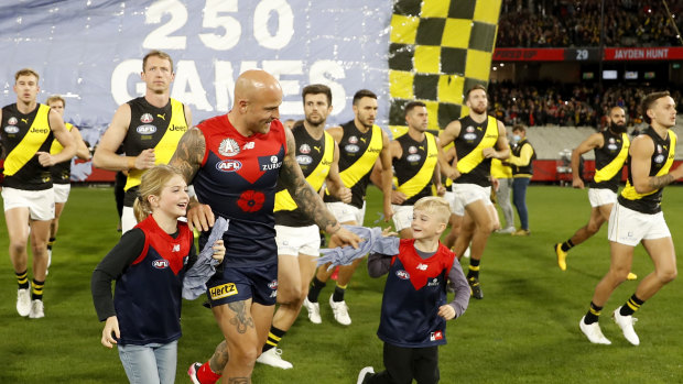 Nathan Jones runs onto the ground for his 300th game earlier this season.