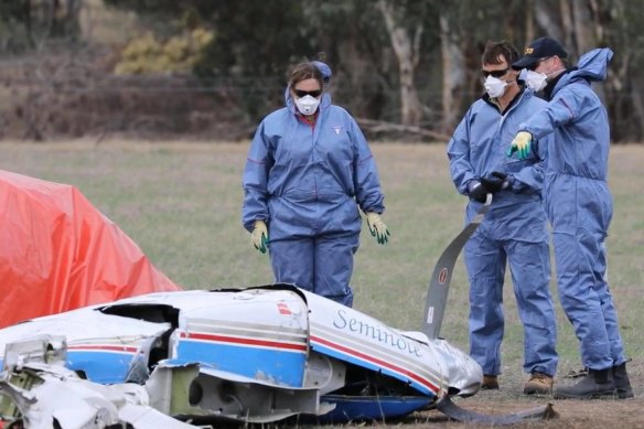 Investigators at the scene of one of the plane crashes on Wednesday.