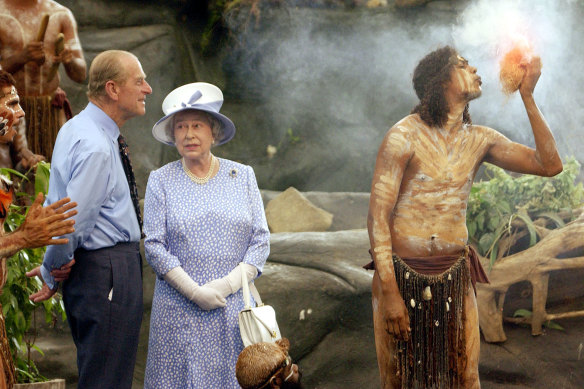 The Queen and the Duke of Edinburgh watch a culture show at Tjapukai Aboriginal Culture Park, Cairns.
