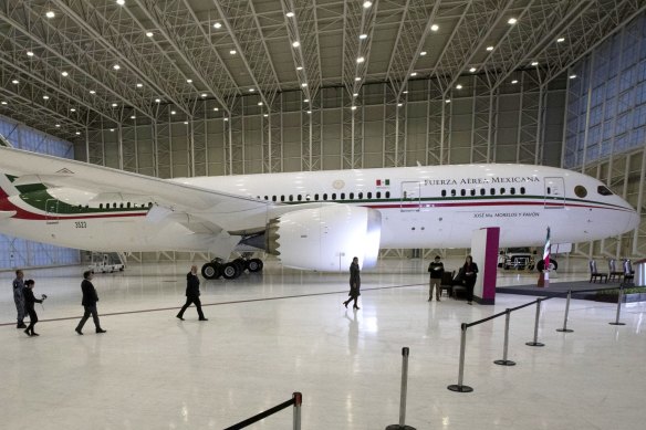 Mexican President Andres Manuel Lopez Obrador, centre left, waves before a press conference in 2020 about the luxury private jet.