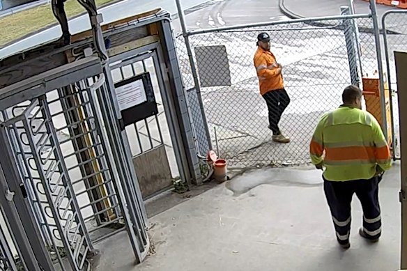 Richie Atutulo (orange shirt) pacing outside after threatening to fight someone.