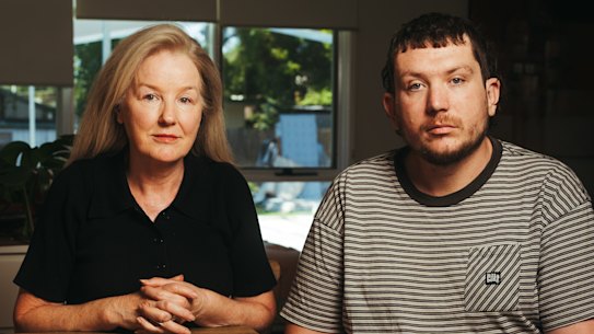 Drew Dowsley was struck by a train in September, just hours after he was turned away from Gosford Hospital in a state of psychosis. He miraculously survived, and now his family is launching campaign with his mother Helen Dowsley to ensure the tragedy does not happen to anyone else. Helen and Drew looking at old photos of Drew as a child, at their home in Mittagong, Tuesday 4th of February 2025.  Photo: Dion Georgopoulos / The Sydney Morning Herald