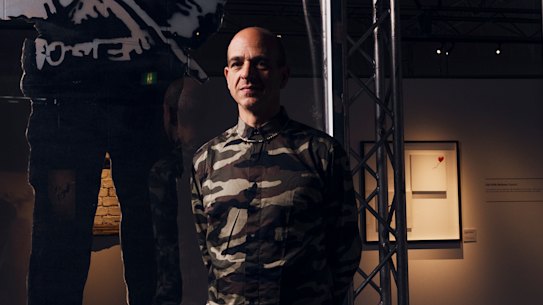 Portrait of Steve Lazarides, former manager, agent and photographer for british street artist Banksy. Pictured with one of Banky's works at The Art of Banksy exhibition at Entertainment Quarter, Moore Park. Photographed Thursday 12th September 2019. Photograph by James Brickwood. SMH ARTS 190912