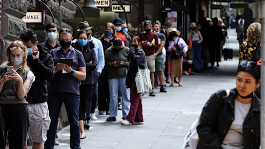 People queue outside Melbourne Town Hall Covid-19 testing centre on Wednesday.