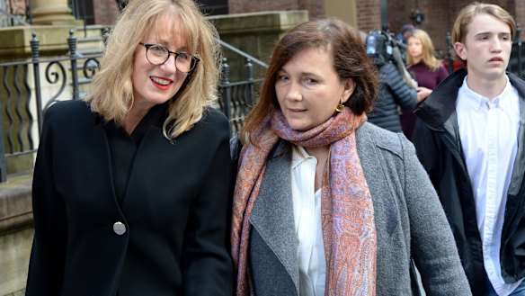 Kimberley McGurk, right, wife of murder victim Michael McGurk leaves Ron Medich's sentencing. 