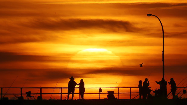The sun rises over the Altona pier on Thursday mornng. 