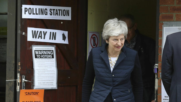British Prime Minister Theresa May leaves after casting her vote at a polling station near her home in the Thames Valley.