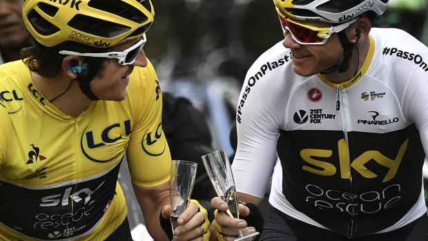 In sync: Team Sky's Geraint Thomas and teammate Chris Froome en route to Paris on Sunday.