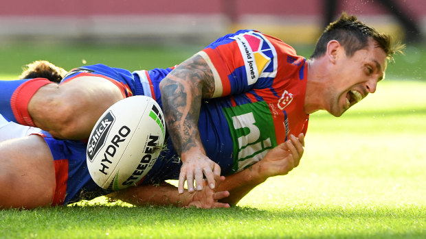 'It's in the past': Mitchell Pearce scores for the Knights against the Bulldogs at Suncorp Stadium on Saturday.