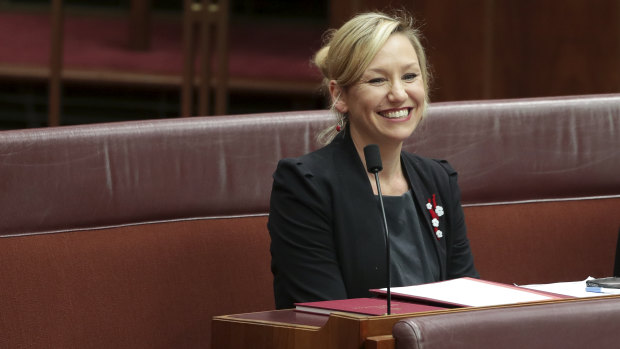 Senator Larissa Waters takes her seat in the Senate after being sworn in at Parliament House in Canberra.