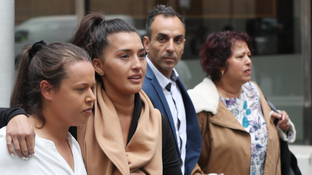 Family members leave court after bikie Robert Ale was jailed for at least 13 years on Friday. 