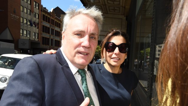 Michael Cranston and his wife Gloria leave the Downing Centre Courts in Sydney on Friday.