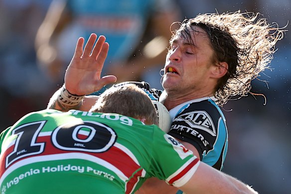 Cronulla halfback Nicho Hynes braces for heavy contact.