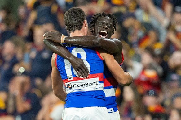 Buku Khamis celebrates with teammate James O’Donnell.