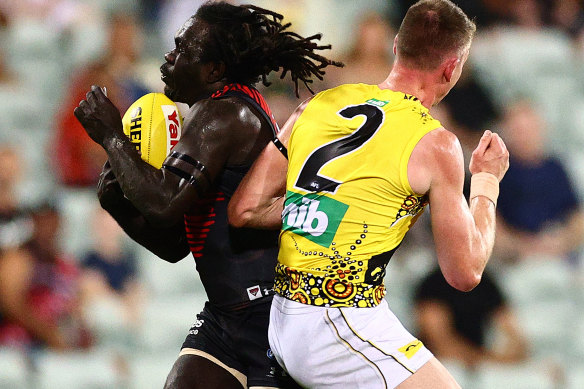 Richmond player Dylan Grimes (right) and Essendon’s Anthony McDonald-Tipungwuti in the controversial game in Darwin last year.
