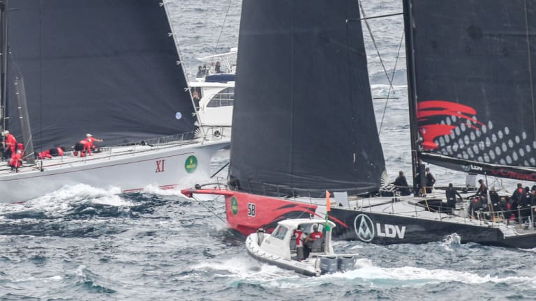 Near miss: Comanche and Wild Oats XI come close to contact as they tack outside the Heads.