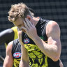 Richmond spearhead Tom Lynch was concussed in a collision with a teammate at pre-season training.