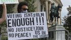 A protester marches in Atlanta, when another black man was killed by police. 