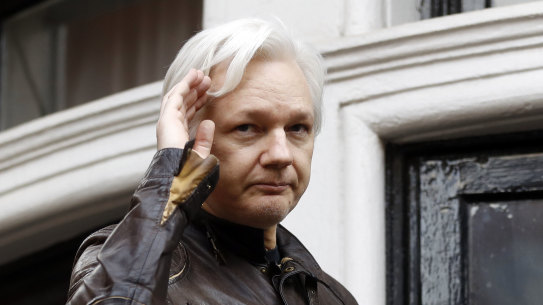 WikiLeaks founder Julian Assange greets supporters from a balcony of the Ecuadorian embassy in London back in 2017.