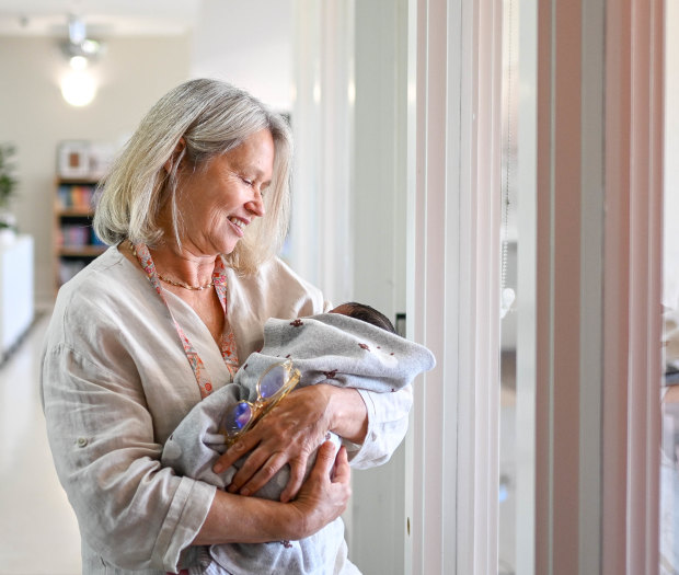 A nurse in Safe Steps’ pilot ‘wrap around’ crisis centre cradles a newborn.