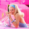 Is the Barbie movie satire? A joyful ode to girl power? Yes and yes!