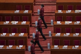 Tea attendants practice before the second plenary session of the National People’s Congress at the Great Hall of the People in March. 