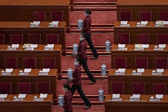 Tea attendants practice before the second plenary session of the National People’s Congress at the Great Hall of the People in March. 