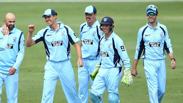 Pat Cummins celebrates with Blues teammates earlier this year in a match against Victoria. 