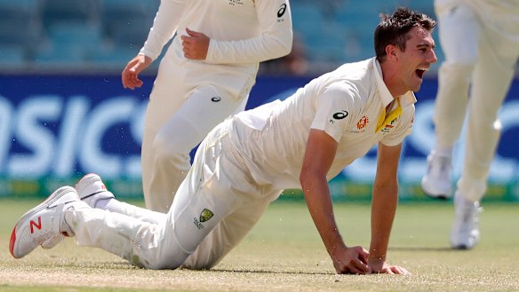 Go-to man: Pat Cummins takes a catch off his own bowling to dismiss Lahiru Thirimanne on Monday.