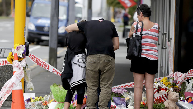 Mourners pay their respects at a makeshift memorial near the Masjid Al Noor mosque in Christchurch.