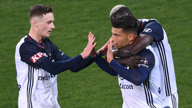Star signing: Socceroo Andrew Nabbout (centre) celebrates a goal for Melbourne Victory.