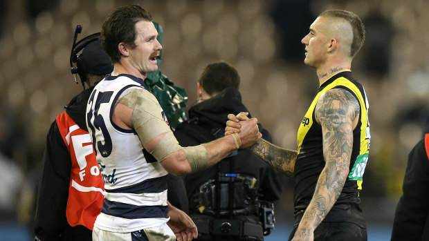 Fair dues: Dustin Martin (right) and Patrick Dangerfield after Richmond edged out Geelong in a tight contest at the MCG.