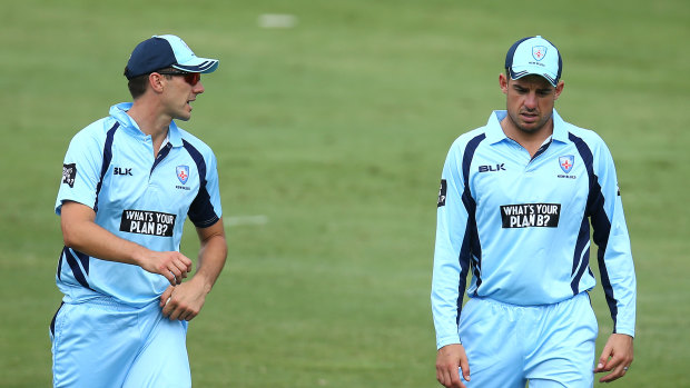 Pat Cummins and Moises Henriques have a chat during a NSW one-day match against Victoria in February. 