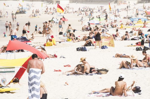 Beachgoers are seen at Bondi Beach on Saturday morning despite the threat of novel coronavirus (COVID-19) in Sydney.