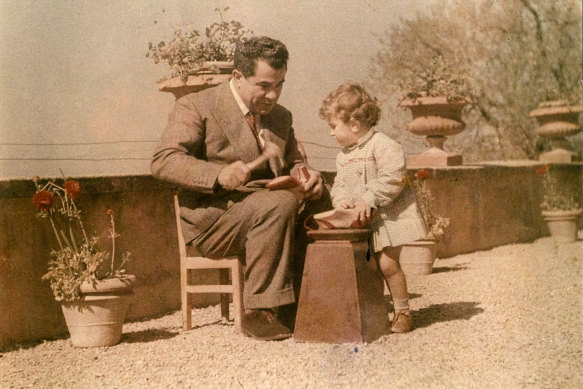 Salvatore Ferragamo showing his son how to make a shoe. 