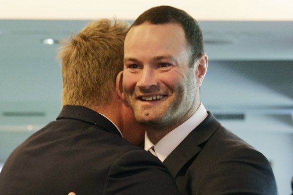 Roosters player Boyd Cordner hugs coach Trent Robinson after announcing his retirement.