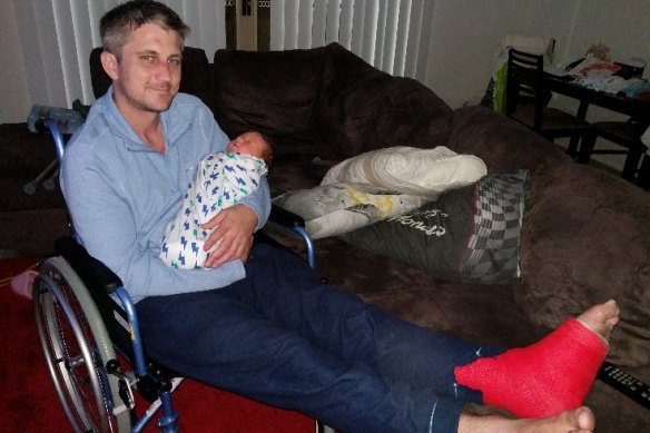 Mr Hetherington with his son Alexander, who was born just days after he was released from hospital.
