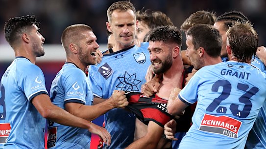 Western Sydney’s Brandon Borello clashes with Sydney FC veteran Alex Wilkinson.