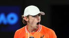 Alex de Minaur reacts to making it through to the fourth round.