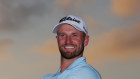 Wyndham Clark poses with his trophy. He thought about quitting golf a decade ago when he struggled with the loss of his mother, Lise, to breast cancer.