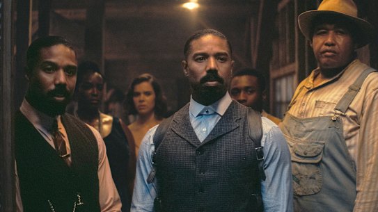 Michael B. Jordan and Michael B. Jordan (playing identical twins) and Omar Benson Miller in Sinners.