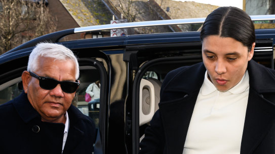 Sam Kerr arrives at court with her father, Roger Kerr.