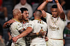  Sione Katoa of Tonga celebrates scoring a try with team mates