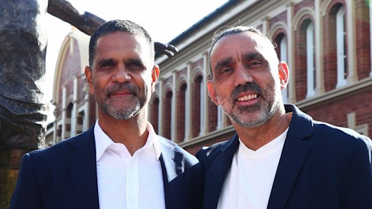 Swans greats Michael O’Loughlin and Adam Goodes unveil the Goodes statue near Swans headquarters last year.