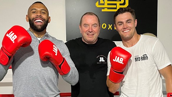 Bulldogs winger Josh Addo-Carr, Paul Gallen’s boxing trainer Graham Shaw and Canterbury halfback Kyle Flanagan after a boxing session.